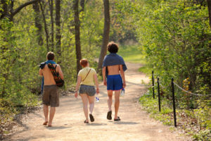 Three students walk along a path at Picnic Point at the University of Wisconsin-Madison during spring on May 10, 2011. 