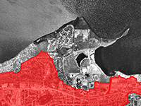 The watershed of Willow Creek is shown in red over a black and white air photo.